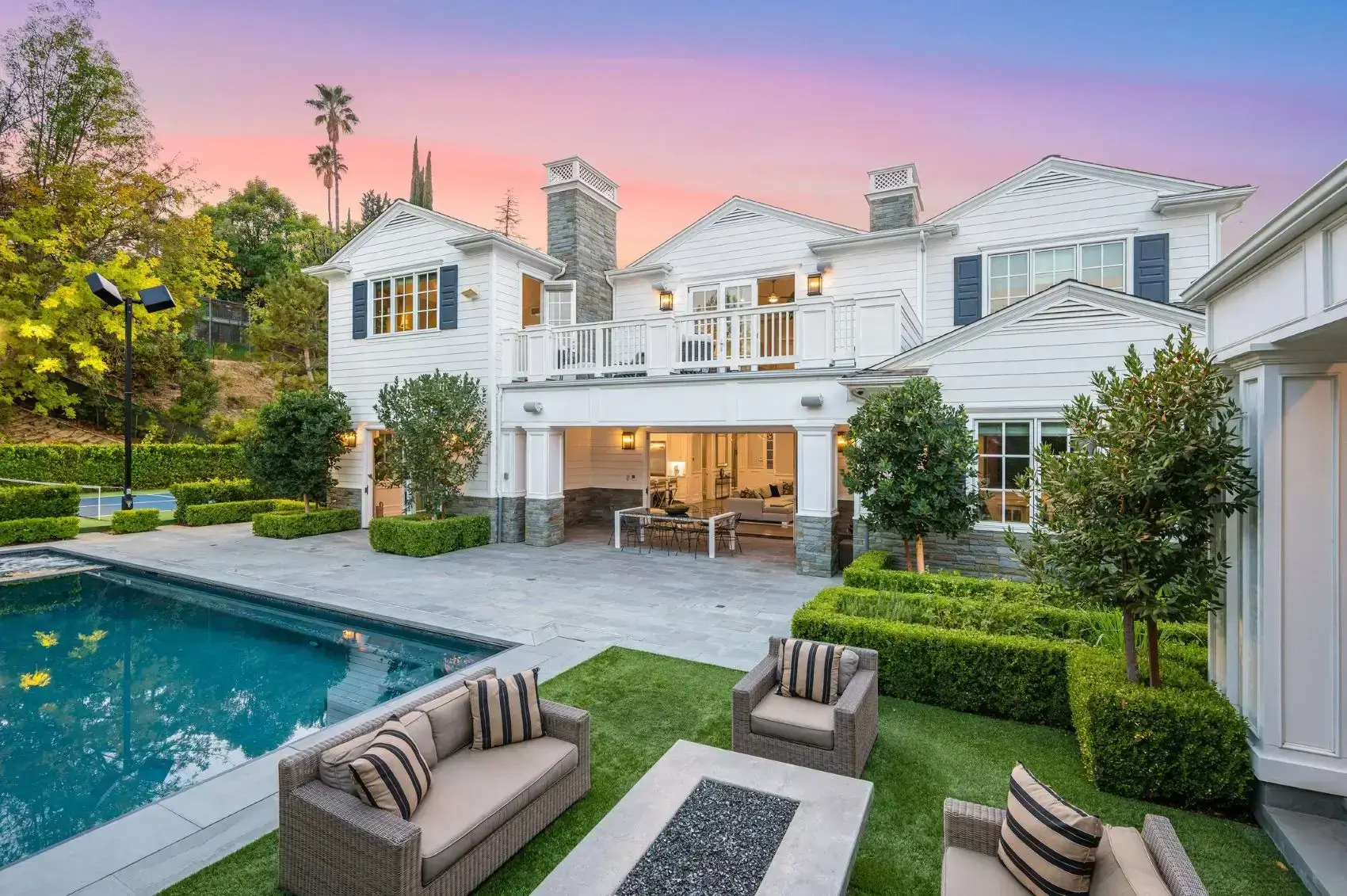 White luxury home with pool and patio