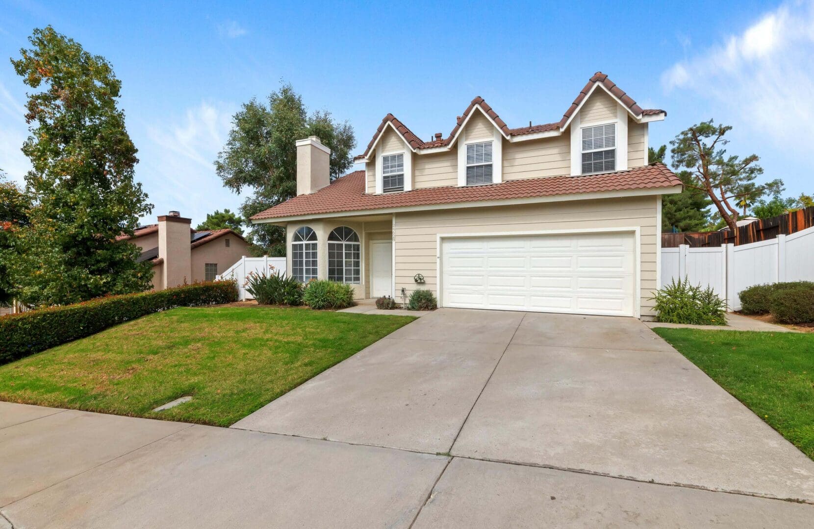 Two-story house with a three-car garage.